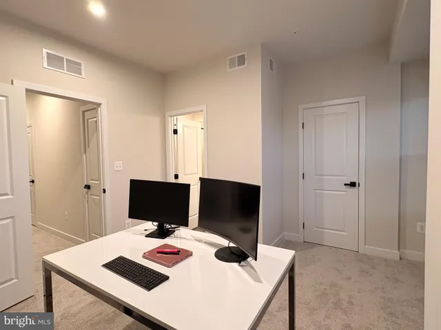 a view of a workspace with furniture