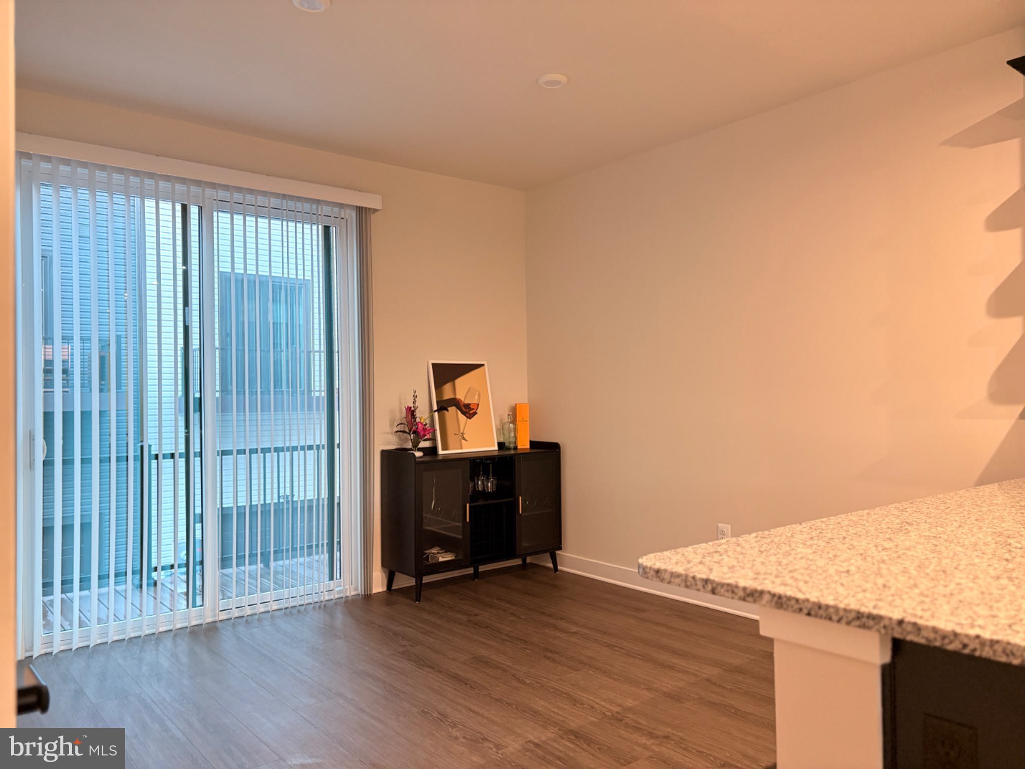 736 Watts Street Baltimore, MD 21217 - Photo 10 of 32 a view of workspace with wooden floor