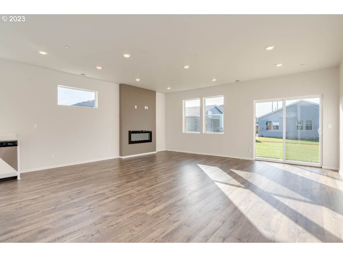 2683 Fenya Street Springfield, OR 97477 - Photo 7 of 21 a view of an empty room with a window and wooden floor