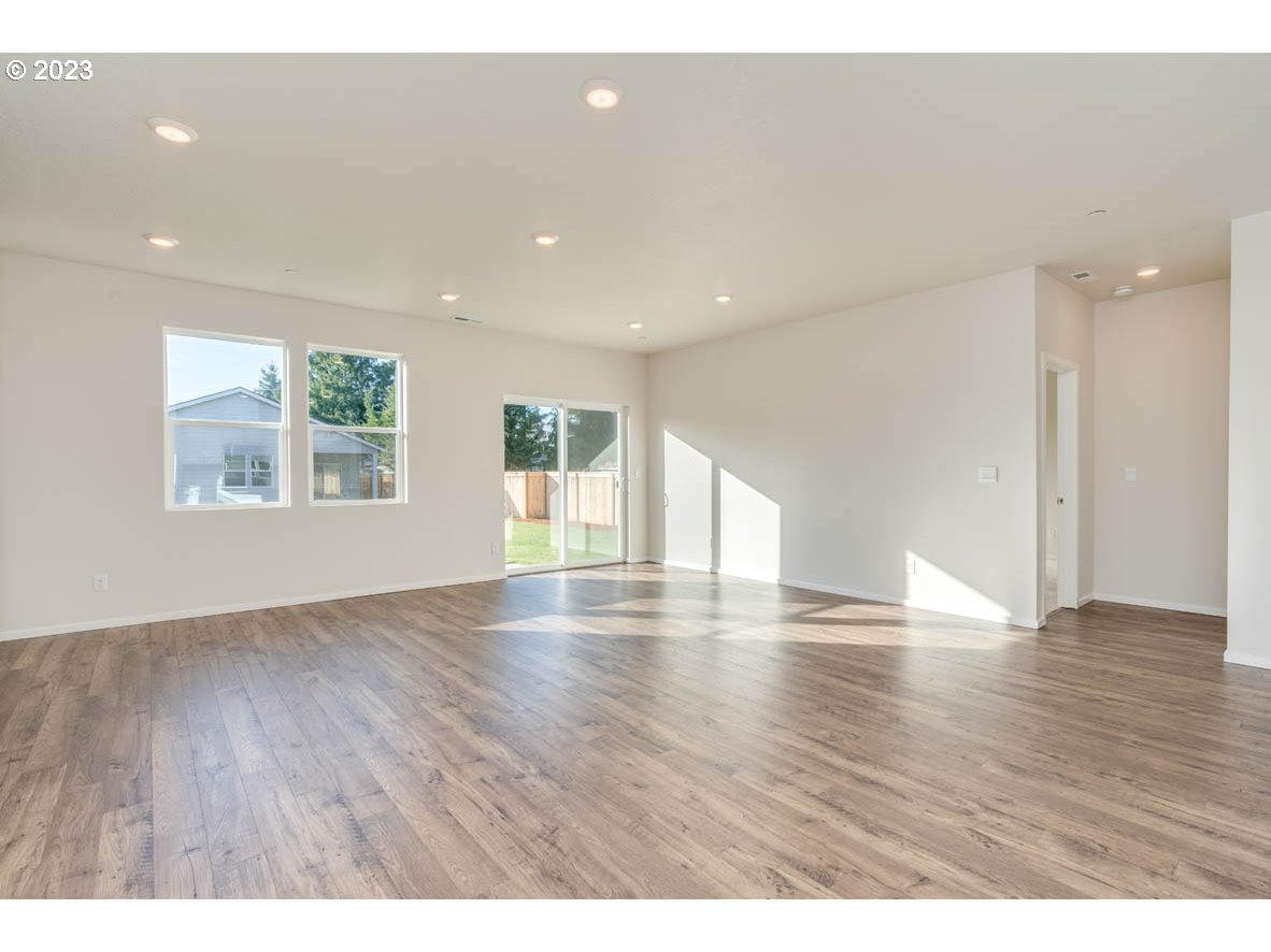 2683 Fenya Street Springfield, OR 97477 - Photo 8 of 21 a view of an empty room with wooden floor and a window