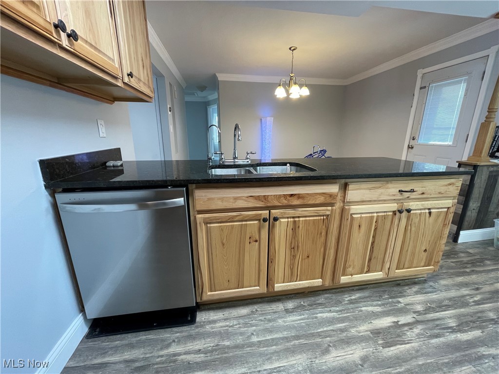 8428 Ridge Road North Royalton, OH 44133 - Photo 5 of 29 Kitchen featuring dishwasher, ornamental molding, a peninsula, a chandelier, and dark wood finished floors