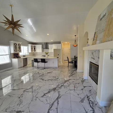 a large kitchen with cabinets and a stove