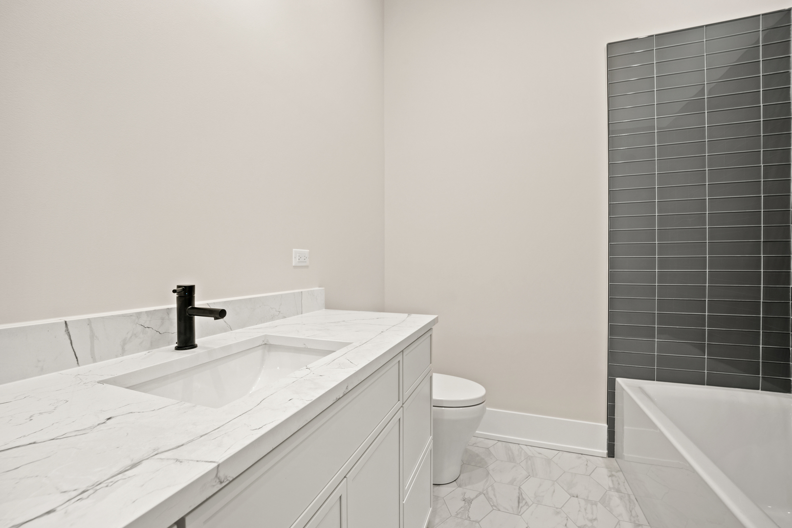 4347 North Richmond Street, Unit 3N Chicago, IL 60618 - Photo 17 of 34 a bathroom with a granite countertop sink toilet and bathtub