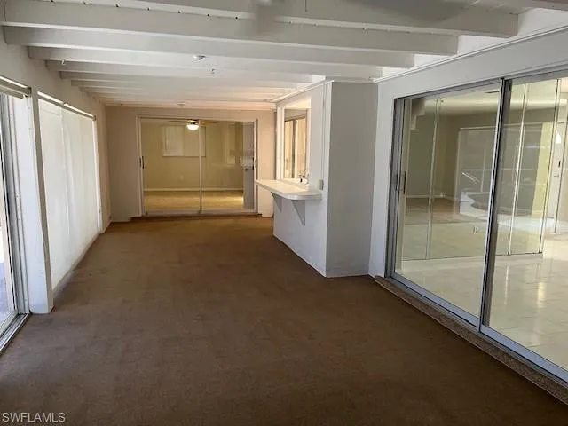 a kitchen with cabinets stainless steel appliances and a counter space