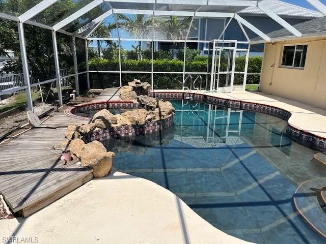 a backyard of a house with sofas