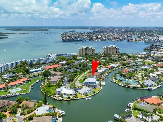 an aerial view of a house with a lake view