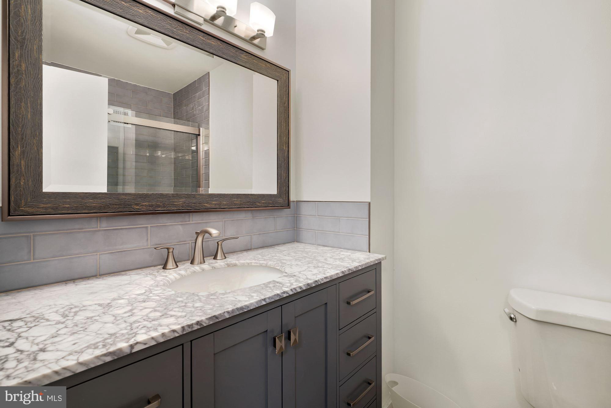 8801 Postoak Road Potomac, MD 20854 - Photo 22 of 28 Remodeled Hall Bathroom
