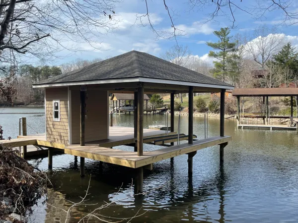 a view of house with swimming pool outdoor seating area