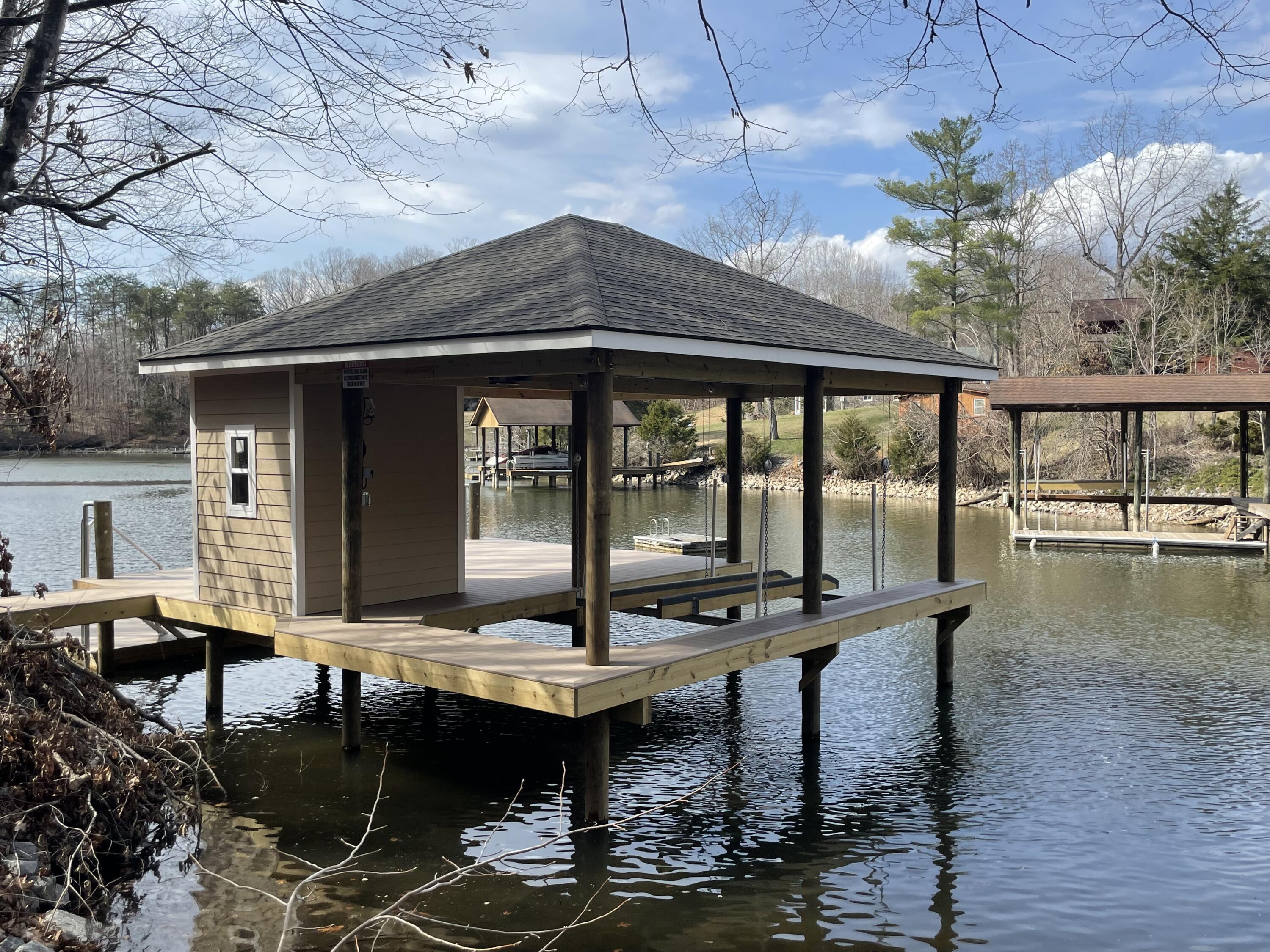 4 Lester Lane Goodview, VA 24095 - Photo 1 of 10 a view of house with swimming pool outdoor seating area