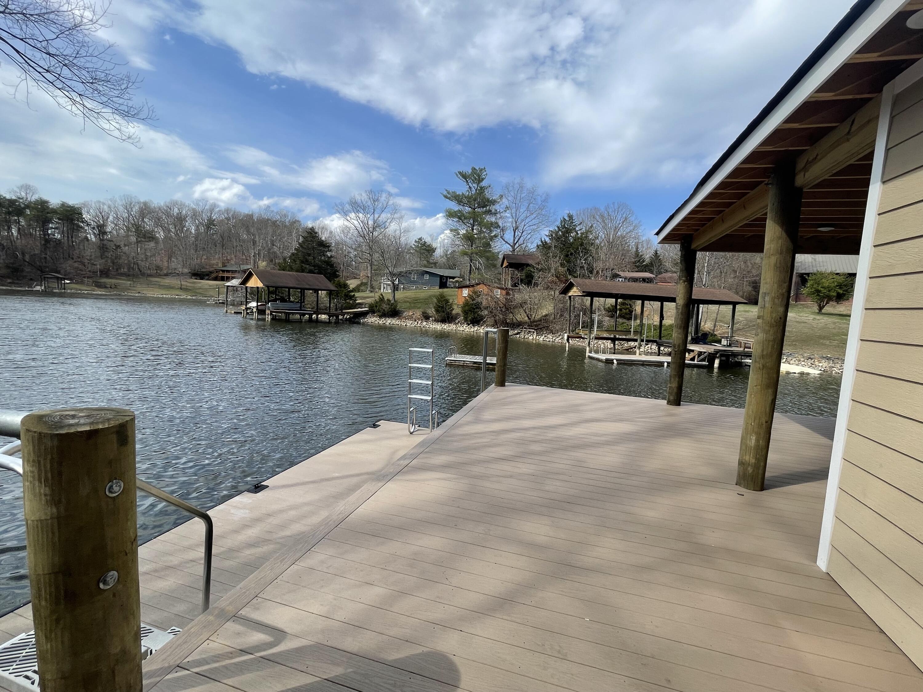 4 Lester Lane Goodview, VA 24095 - Photo 6 of 10 a view of a lake with outside seating