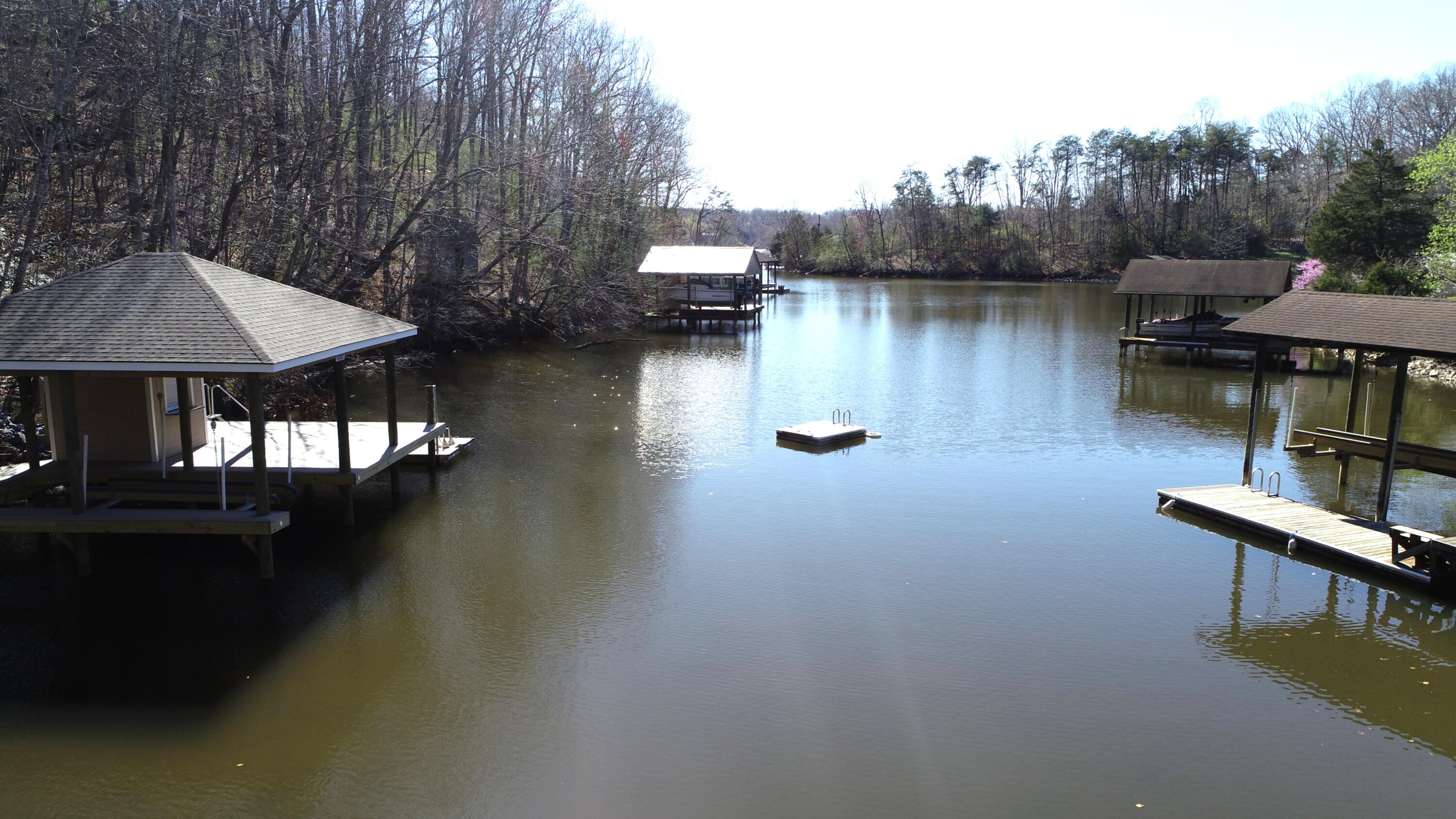 4 Lester Lane Goodview, VA 24095 - Photo 7 of 10 a view of a lake with sitting area