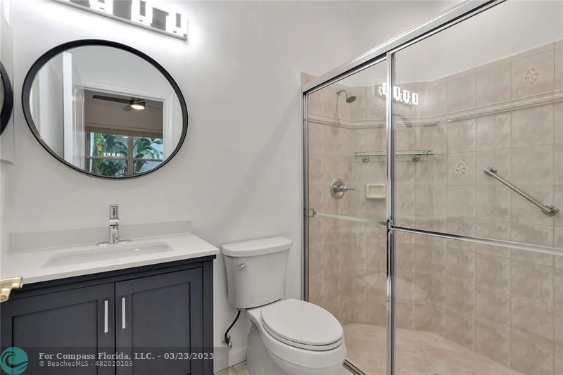 15865 Double Eagle Trail Delray Beach, FL 33446 - Photo 18 of 71 a bathroom with a sink a toilet and a mirror