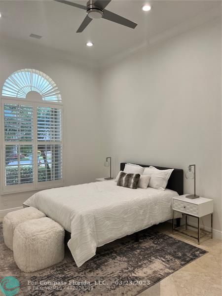 15865 Double Eagle Trail Delray Beach, FL 33446 - Photo 19 of 71 a bedroom with a bed and a large window