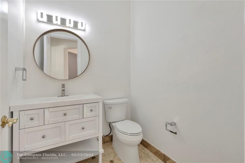 15865 Double Eagle Trail Delray Beach, FL 33446 - Photo 20 of 71 a bathroom with a sink a toilet and a mirror