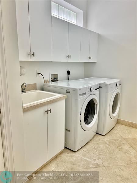 15865 Double Eagle Trail Delray Beach, FL 33446 - Photo 21 of 71 a utility room with sink dryer and washer