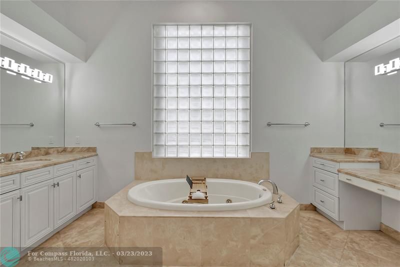 15865 Double Eagle Trail Delray Beach, FL 33446 - Photo 42 of 71 a bathroom with a bathtub and a sink