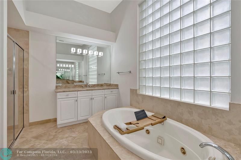 15865 Double Eagle Trail Delray Beach, FL 33446 - Photo 44 of 71 a bathroom with a bathtub and a sink