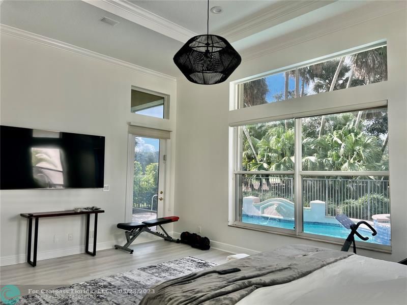 15865 Double Eagle Trail Delray Beach, FL 33446 - Photo 9 of 71 a living room with furniture a window and a flat screen tv