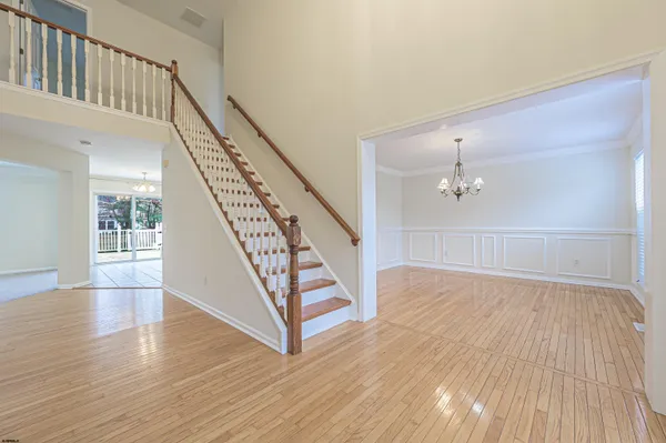 a view of an entryway with wooden floor