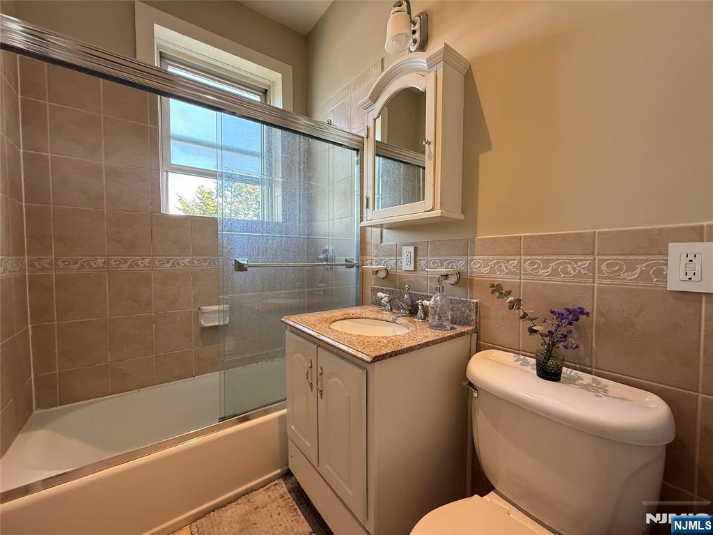215 Orient Way, Unit C2 Rutherford, NJ 07070 - Photo 19 of 25 a bathroom with a sink toilet and shower