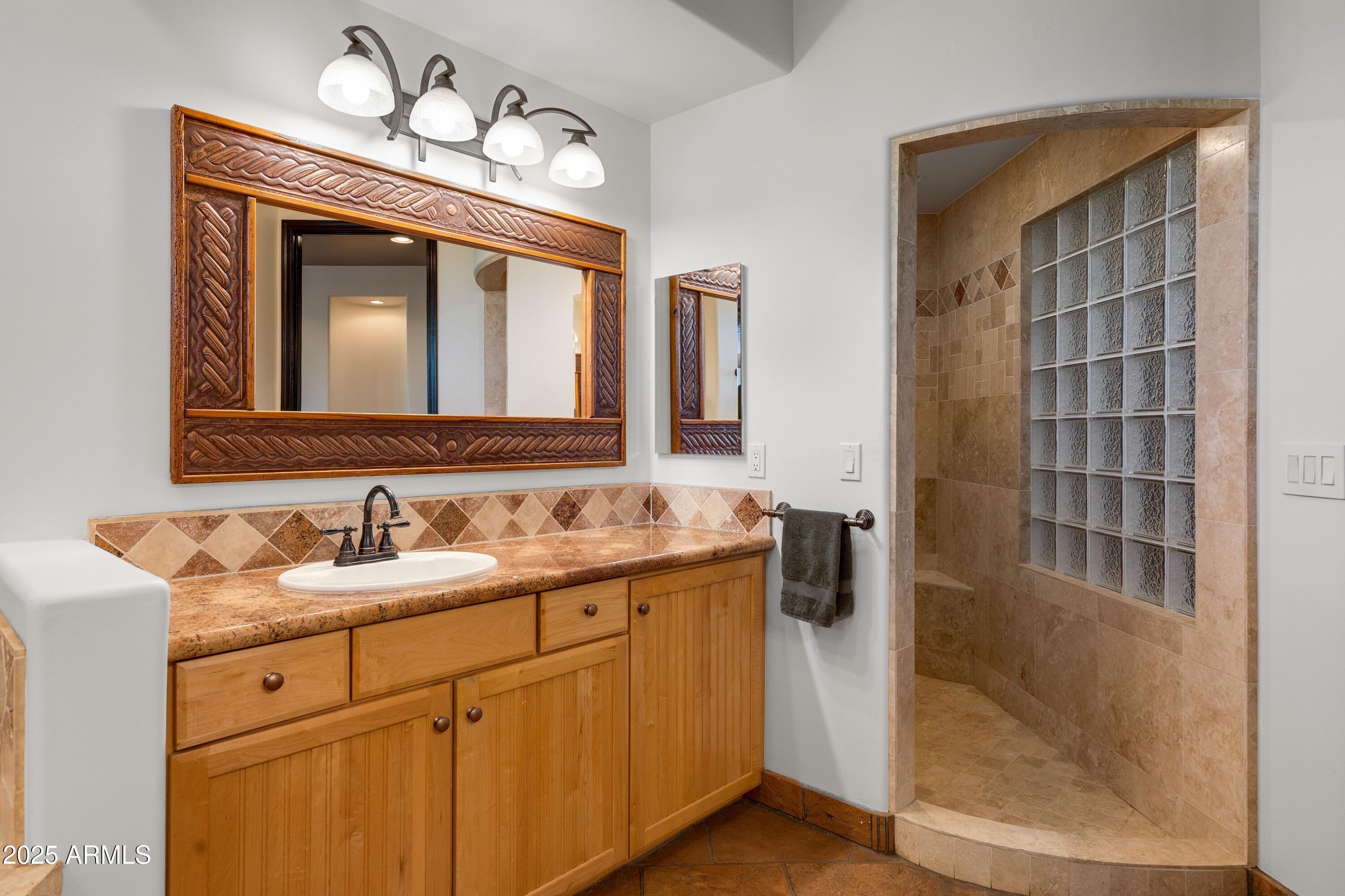 14224 East Rockview Road Scottsdale, AZ 85262 - Photo 34 of 118 a bathroom with a double vanity sink and a mirror
