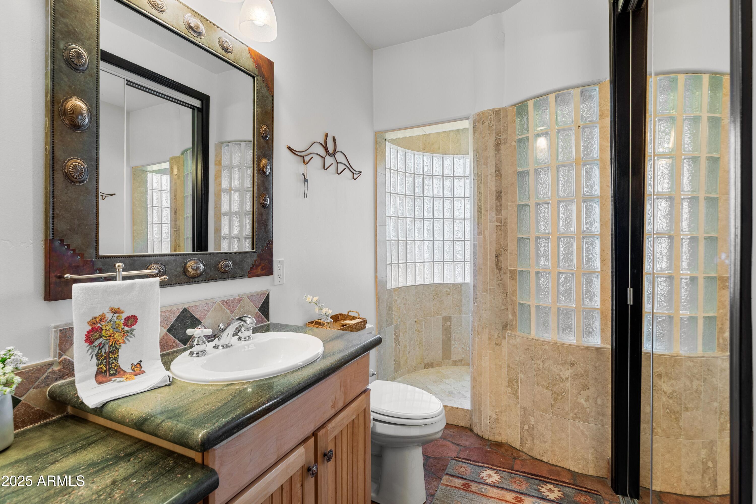 14224 East Rockview Road Scottsdale, AZ 85262 - Photo 39 of 118 a bathroom with a granite countertop sink and a mirror