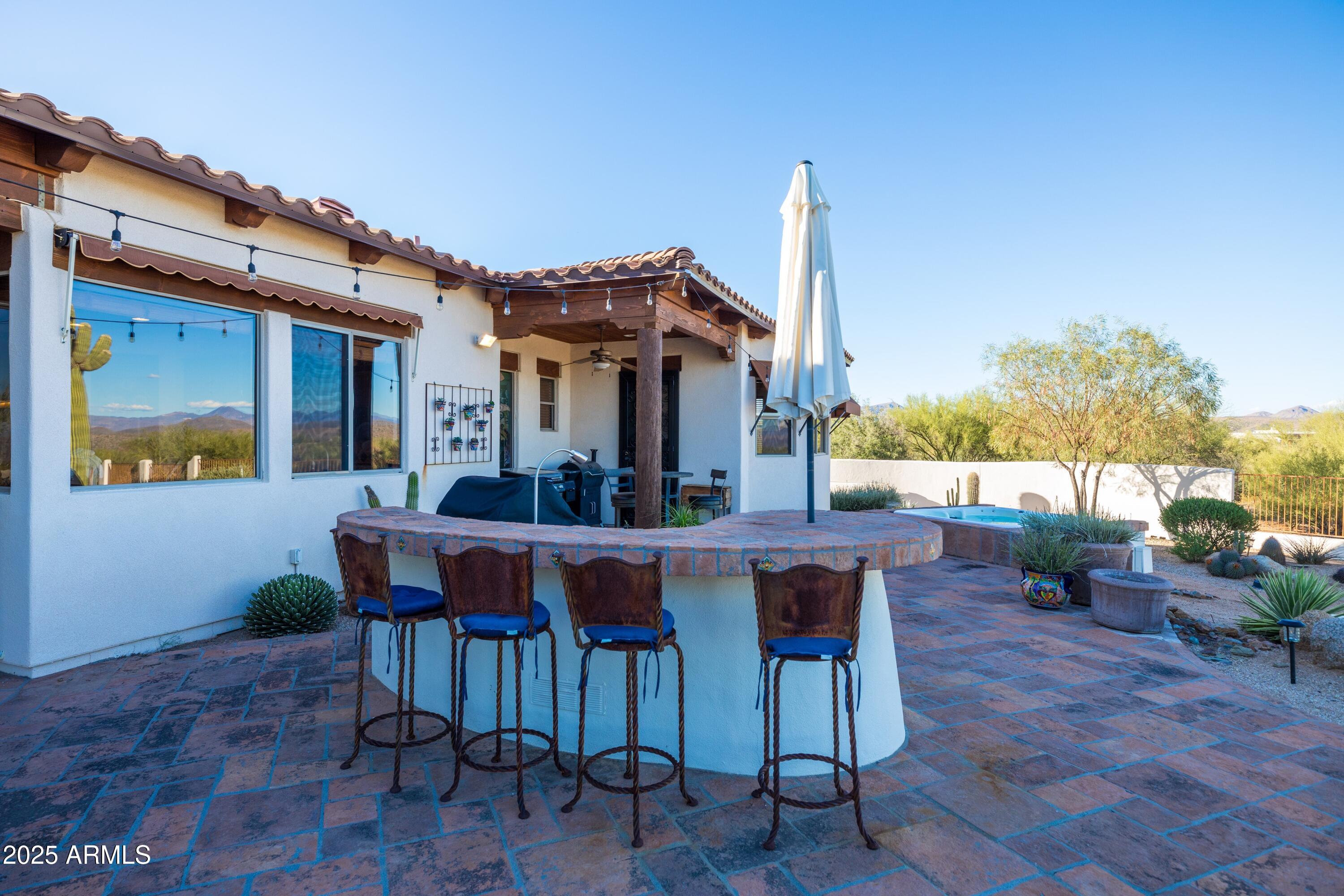 14224 East Rockview Road Scottsdale, AZ 85262 - Photo 57 of 118 a view of a dining table and chairs in the patio