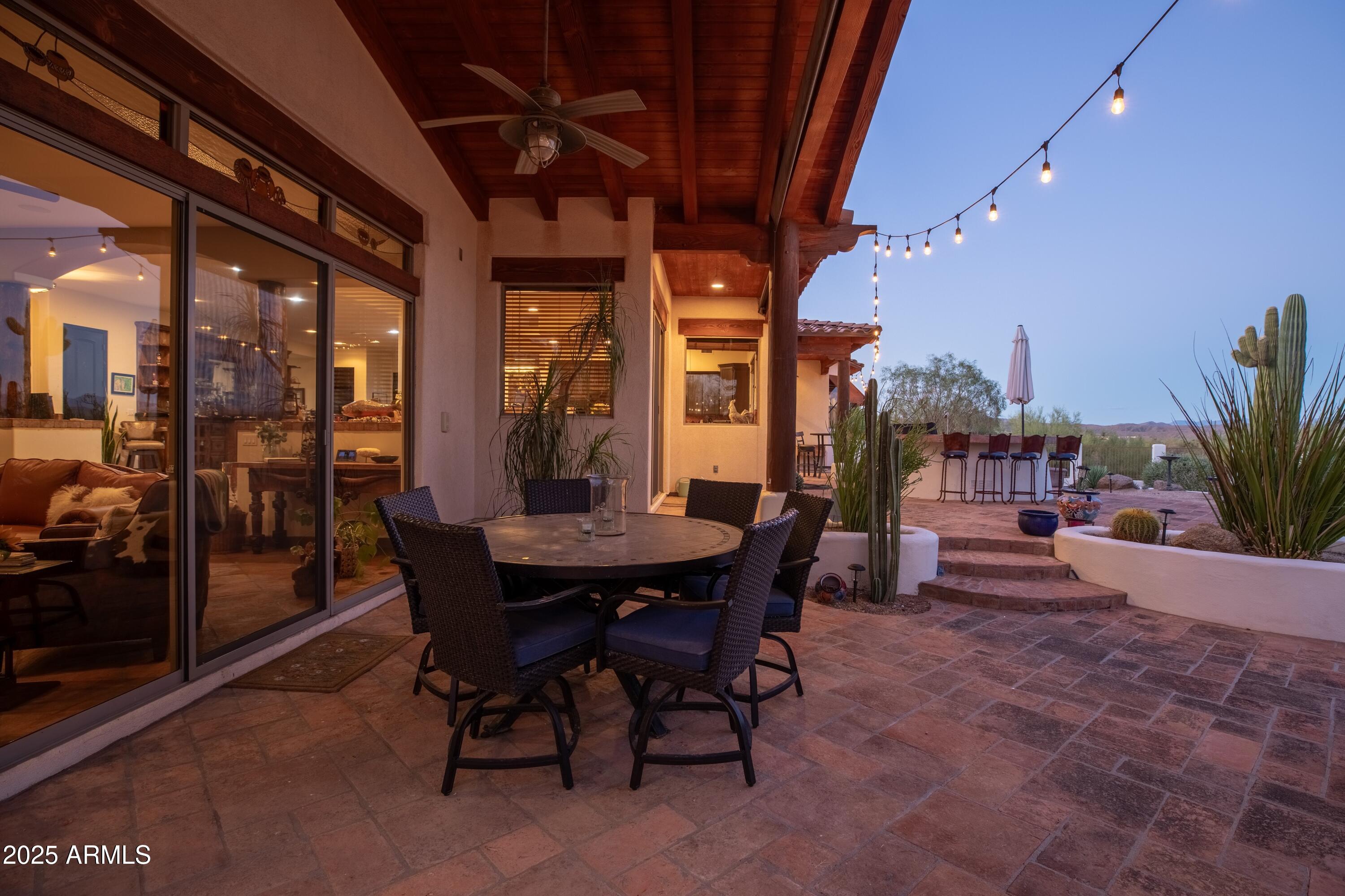 14224 East Rockview Road Scottsdale, AZ 85262 - Photo 58 of 118 a view of a patio with a table and chairs and potted plants