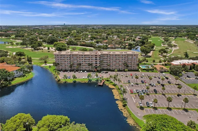 an aerial view of residential houses with outdoor space and street view
