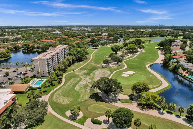 an aerial view of a house with a lake view