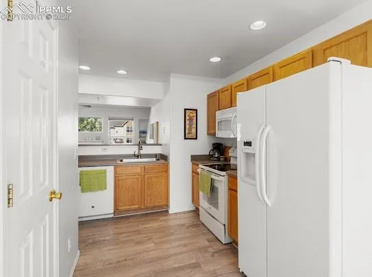a kitchen with a refrigerator and a stove