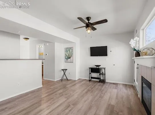 a view of a livingroom with furniture and a flat screen tv