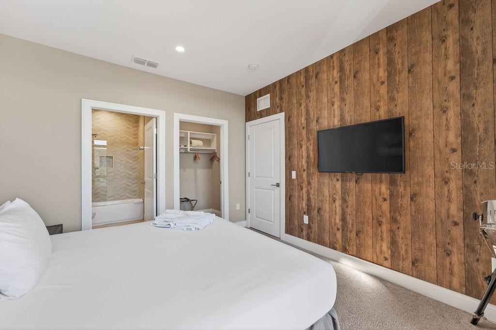 3119 Rockefeller Way Kissimmee, FL 34747 - Photo 22 of 57 a bedroom with a bed and a flat screen tv
