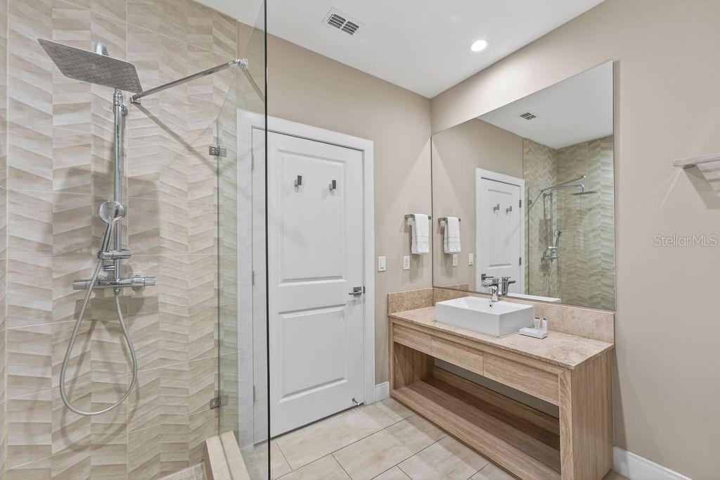 3119 Rockefeller Way Kissimmee, FL 34747 - Photo 36 of 57 a spacious bathroom with a shower and a sink