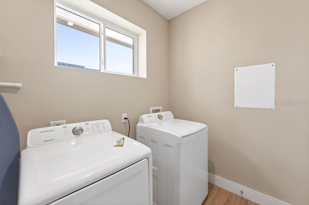 3119 Rockefeller Way Kissimmee, FL 34747 - Photo 38 of 57 a utility room with dryer and washer