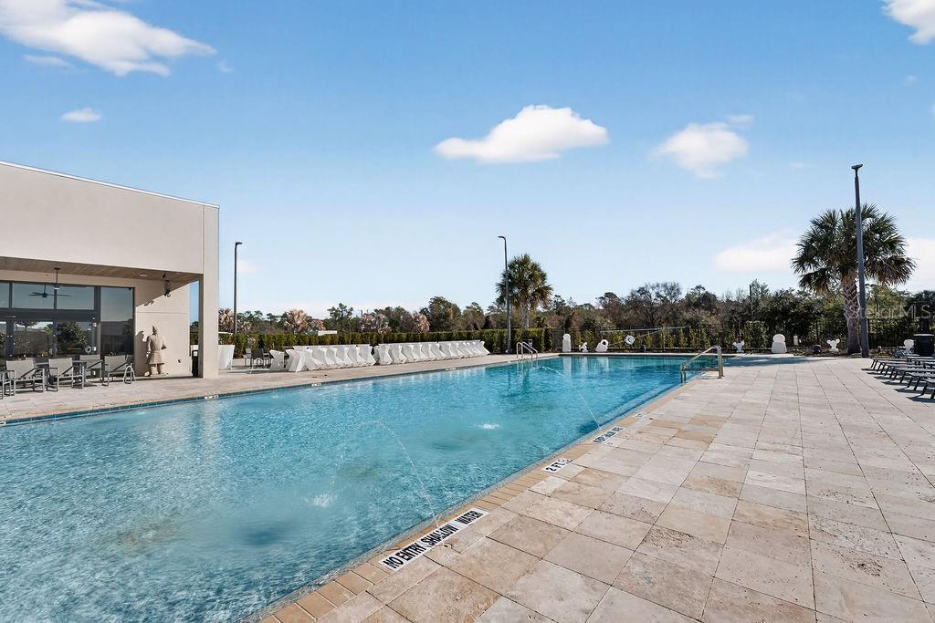 3119 Rockefeller Way Kissimmee, FL 34747 - Photo 51 of 57 a view of a swimming pool and lounge chairs