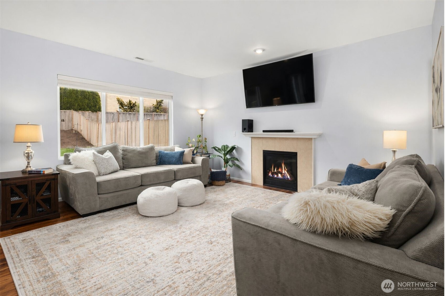 4119 167th Place Southeast Bothell, WA 98012 - Photo 6 of 39 a living room with furniture a flat screen tv and a fireplace