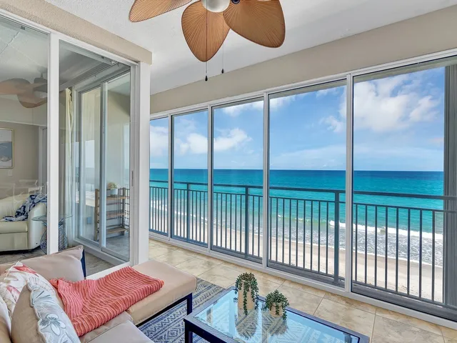 a bedroom with furniture and a large window