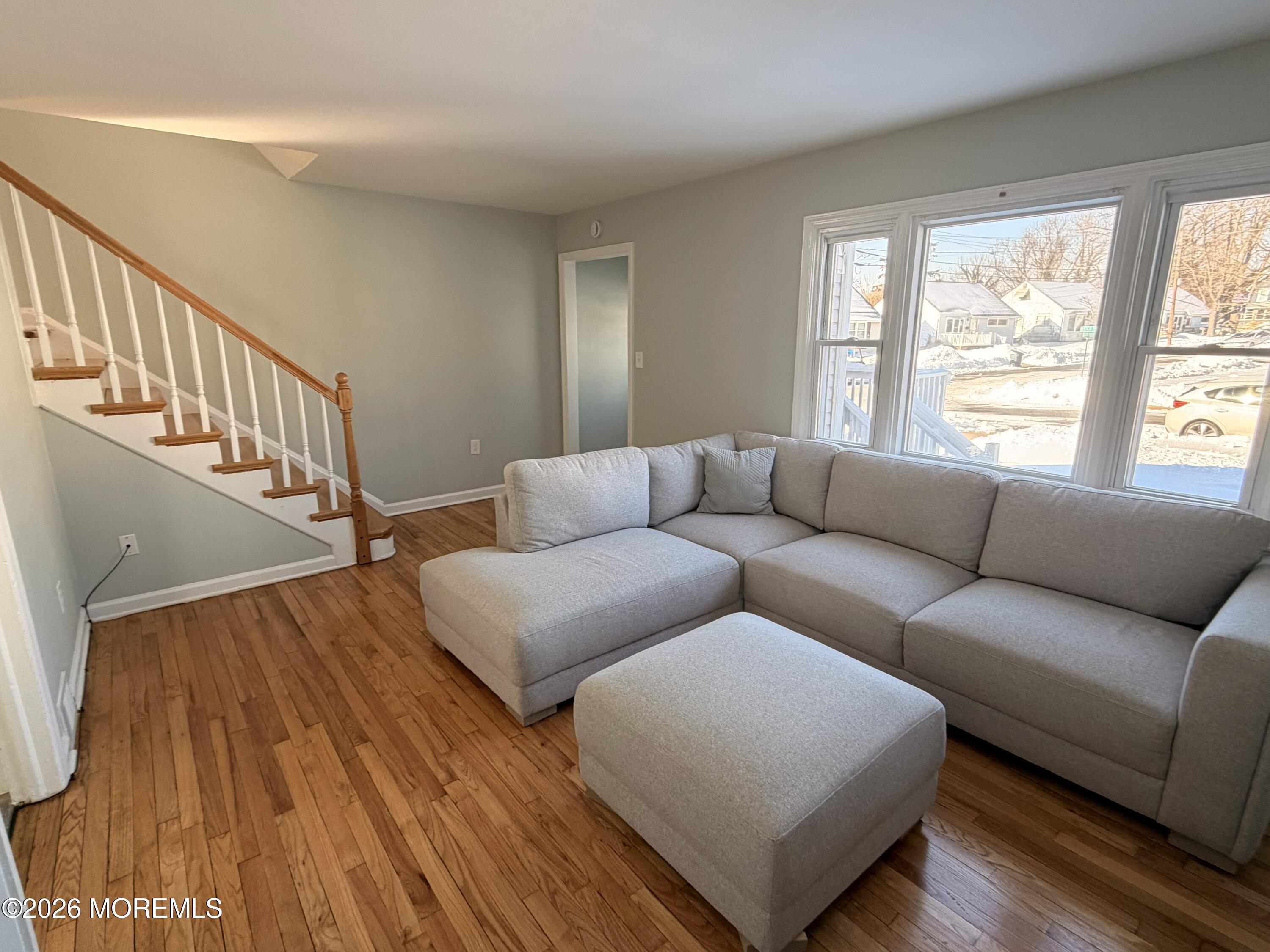 49 Ridge Place Neptune City, NJ 07753 - Photo 2 of 9 a living room with furniture and a hard wood floor