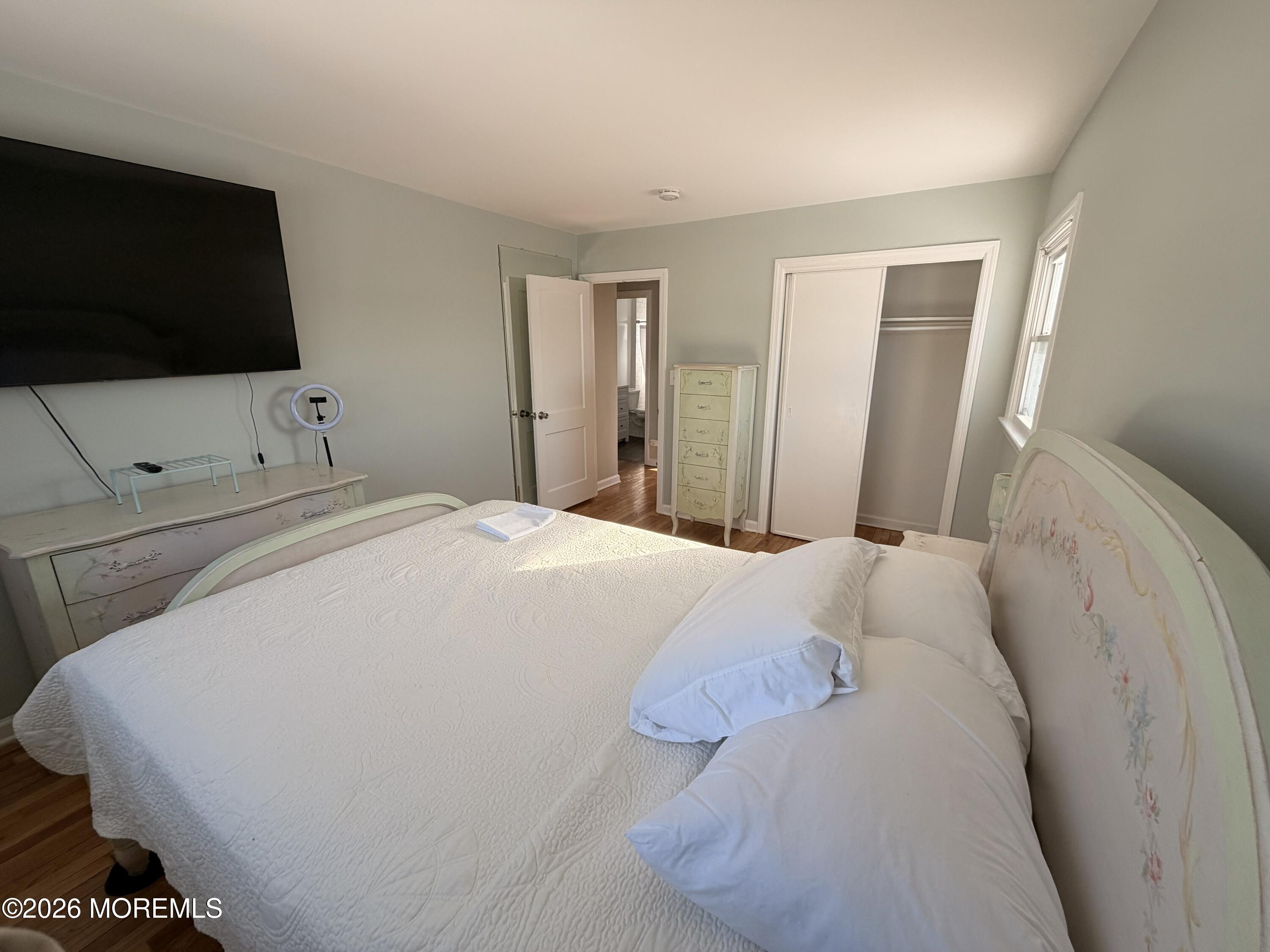 49 Ridge Place Neptune City, NJ 07753 - Photo 7 of 9 a large white bed in a white room