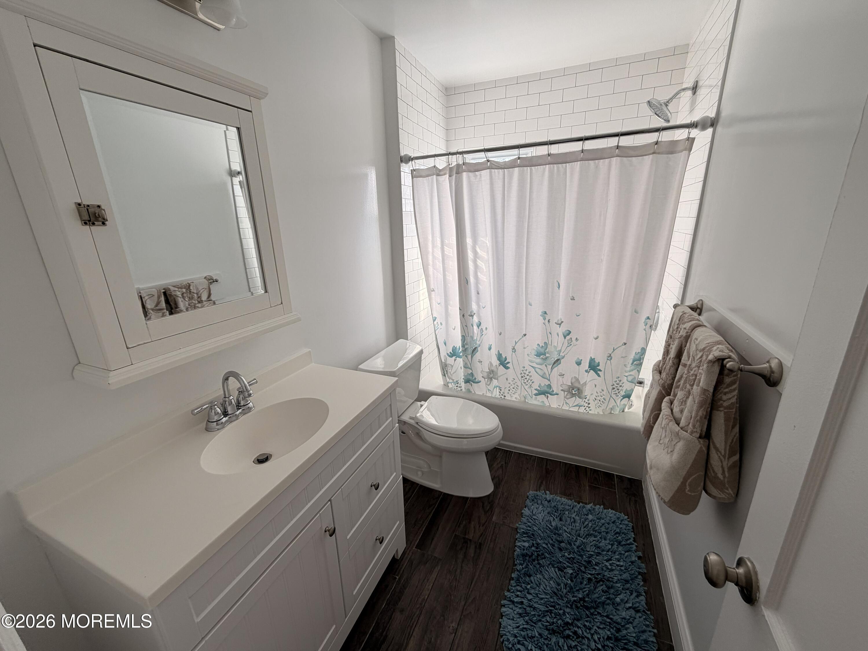 49 Ridge Place Neptune City, NJ 07753 - Photo 9 of 9 a bathroom with a sink toilet and shower
