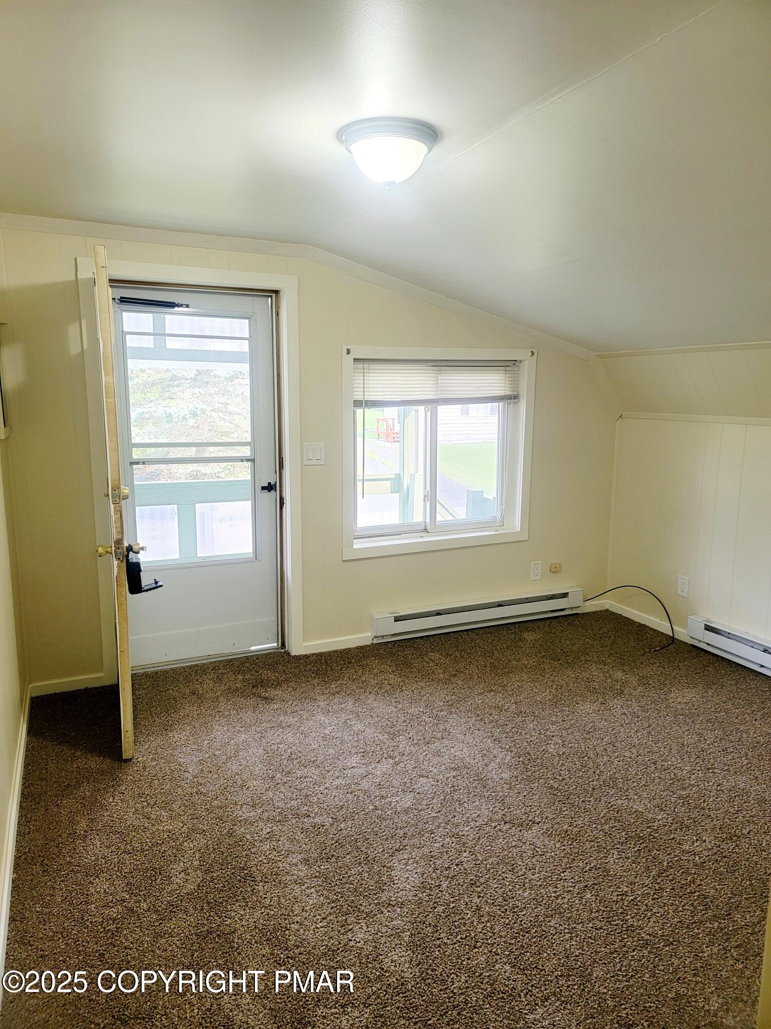 122 Maggie Way, Unit 202 Effort, PA 18330 - Photo 4 of 5 an empty room with a window