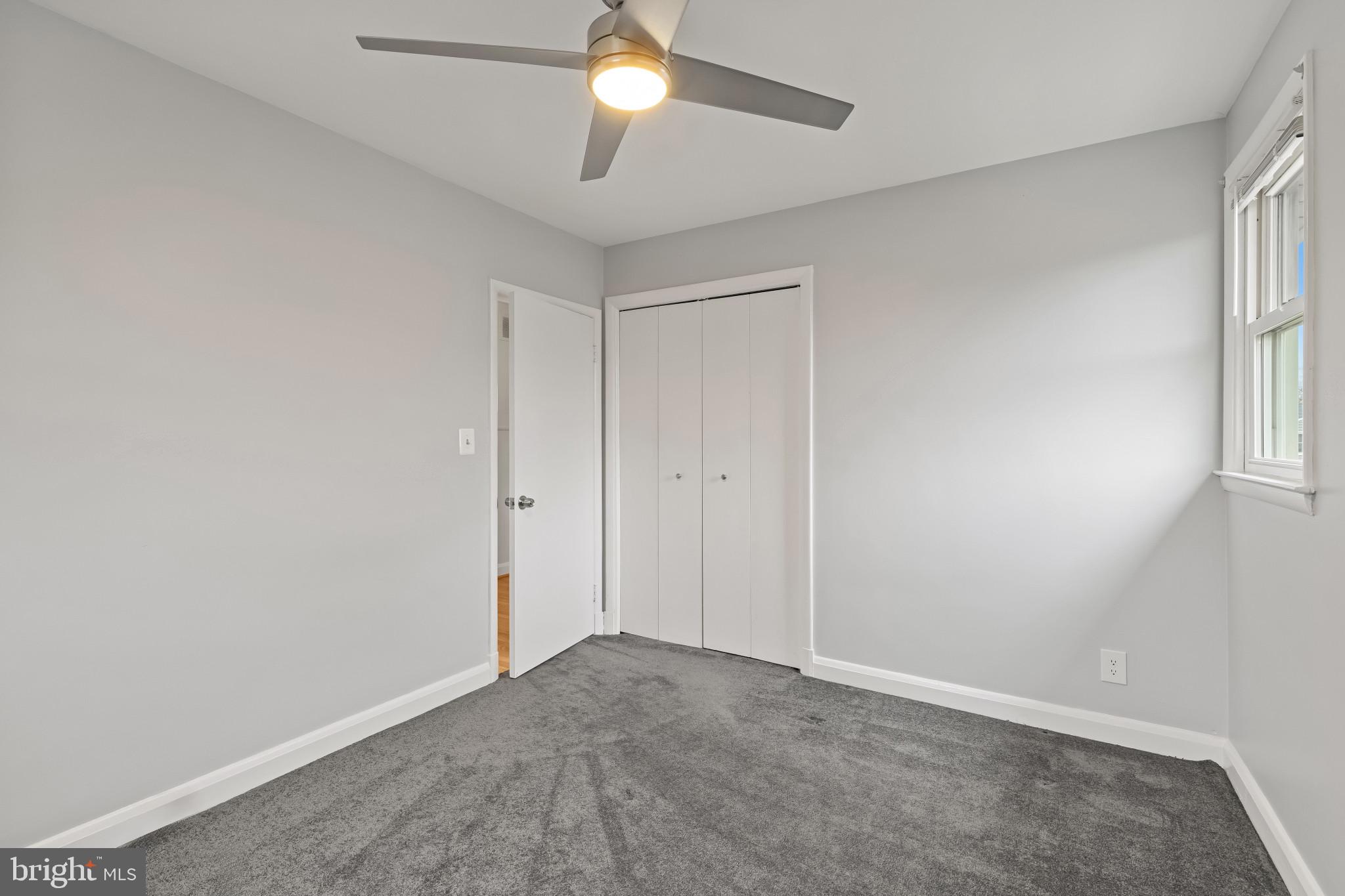 302 Wessling Circle Baltimore, MD 21228 - Photo 24 of 41 an empty room with windows and fan