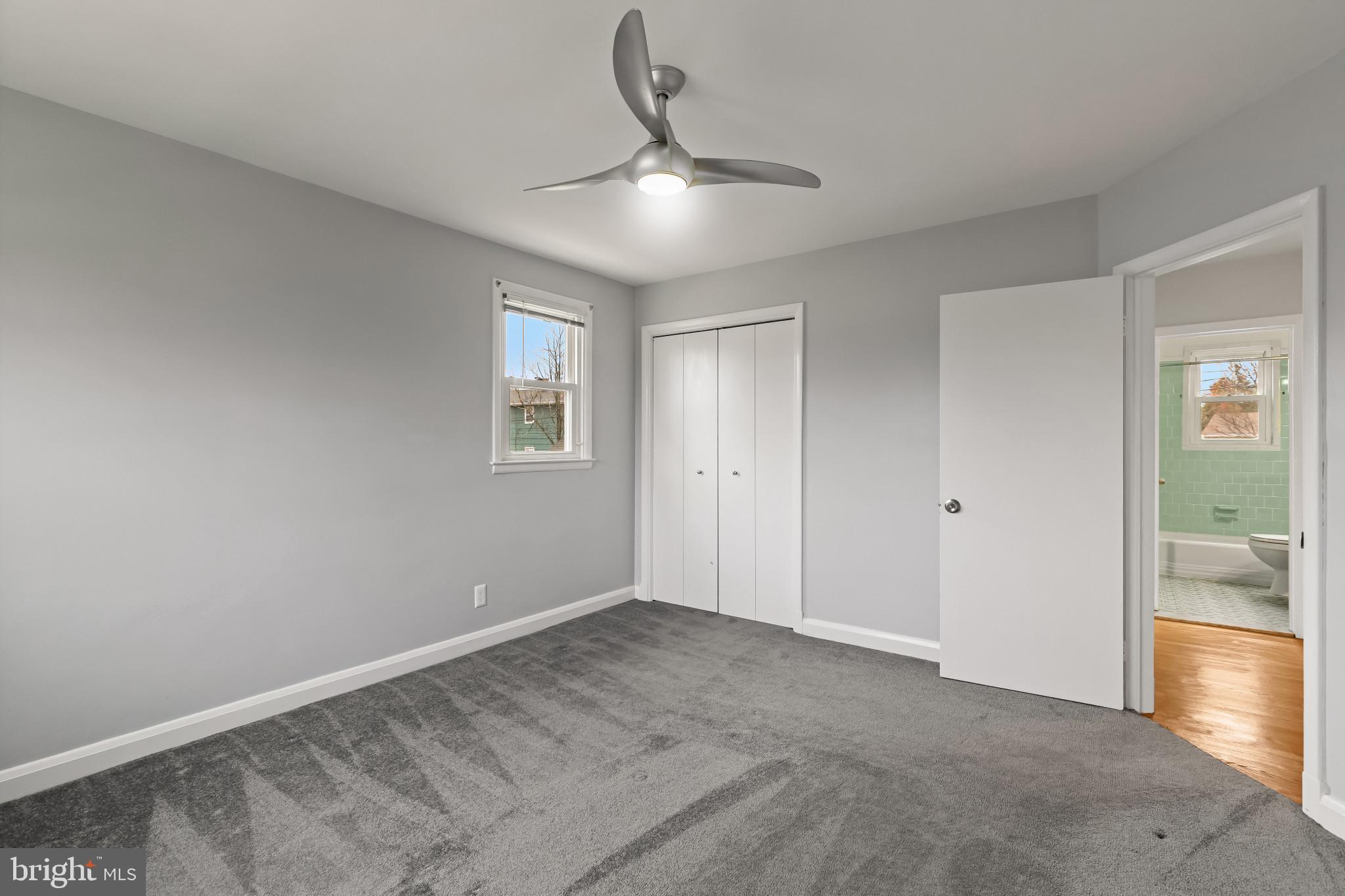 302 Wessling Circle Baltimore, MD 21228 - Photo 25 of 41 a view of an empty room with window and wooden floor