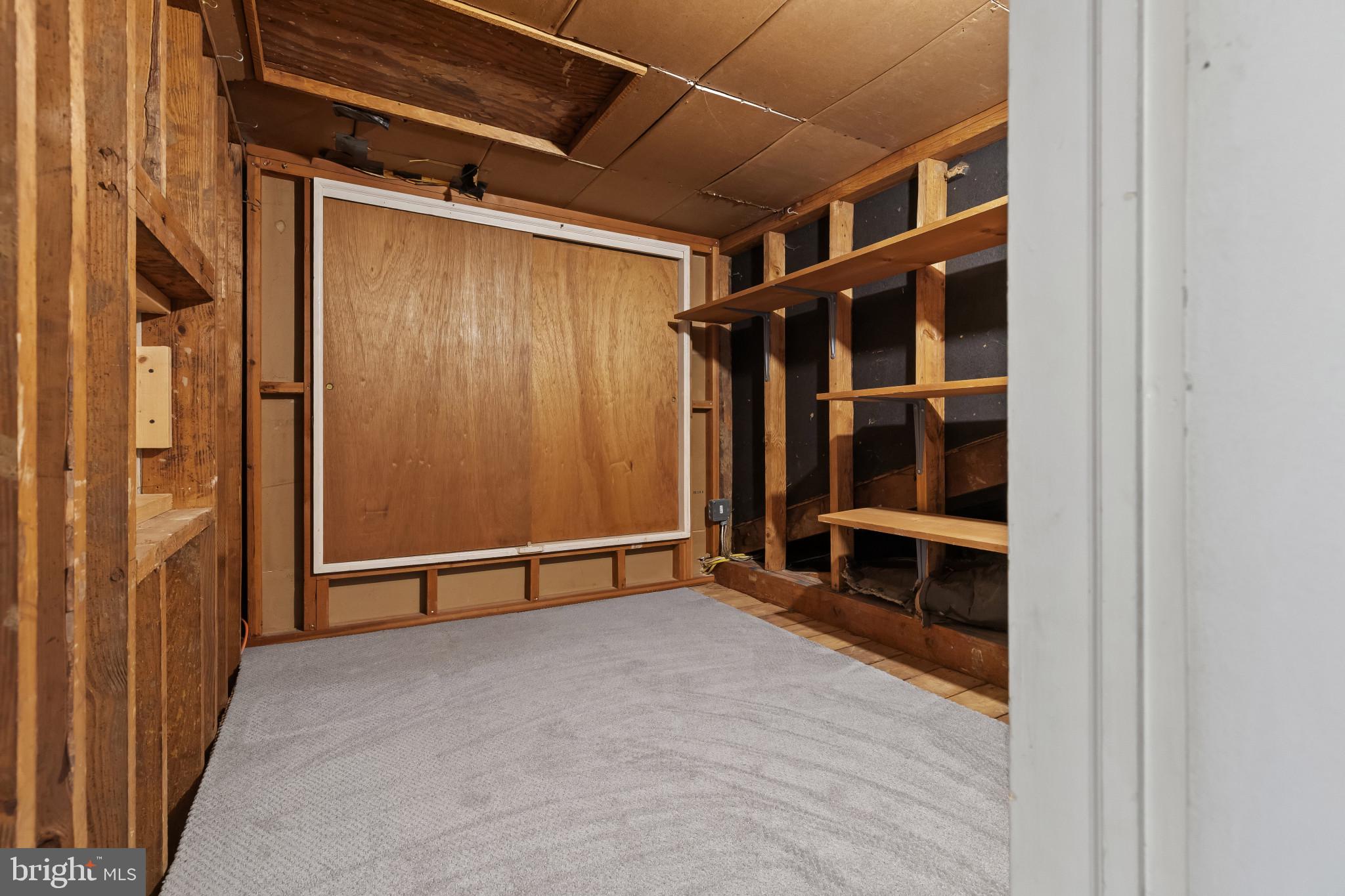 302 Wessling Circle Baltimore, MD 21228 - Photo 29 of 41 a view of an empty room with wooden floor and a window