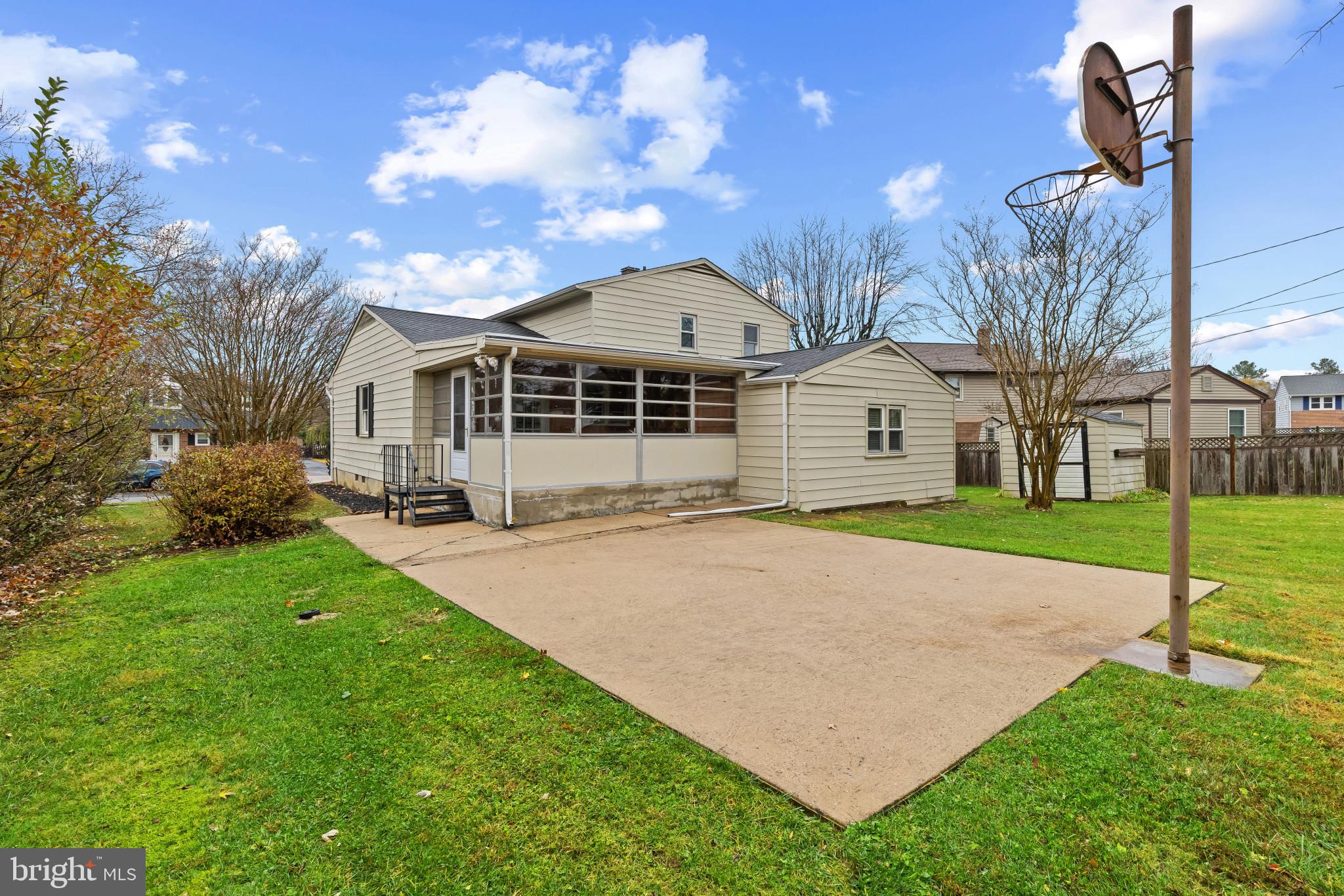 302 Wessling Circle Baltimore, MD 21228 - Photo 36 of 41 a yellow and white house with a yard