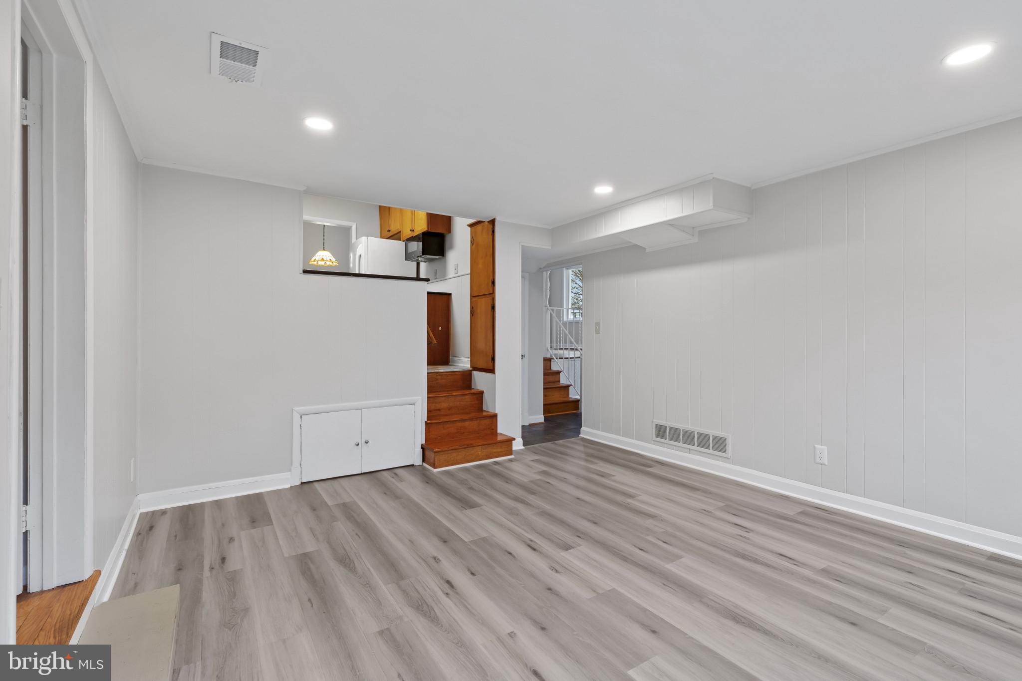 302 Wessling Circle Baltimore, MD 21228 - Photo 10 of 41 a view of room with wooden floor