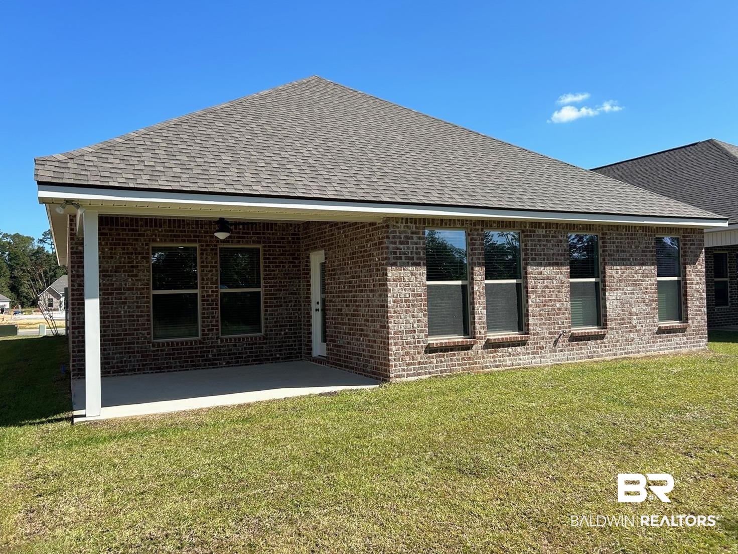 872 Sumter Loop Foley, AL 36535 - Photo 16 of 18 Rear view of property with a patio and a lawn