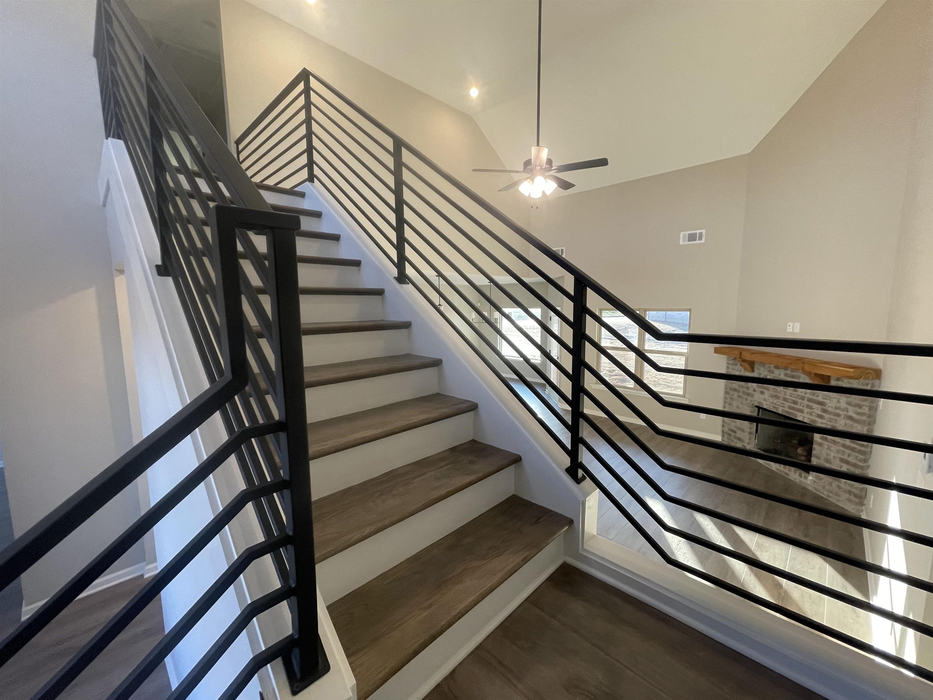 19 Columbia Way Atoka, TN 38004 - Photo 16 of 28 Staircase featuring ceiling fan and wood finished floors