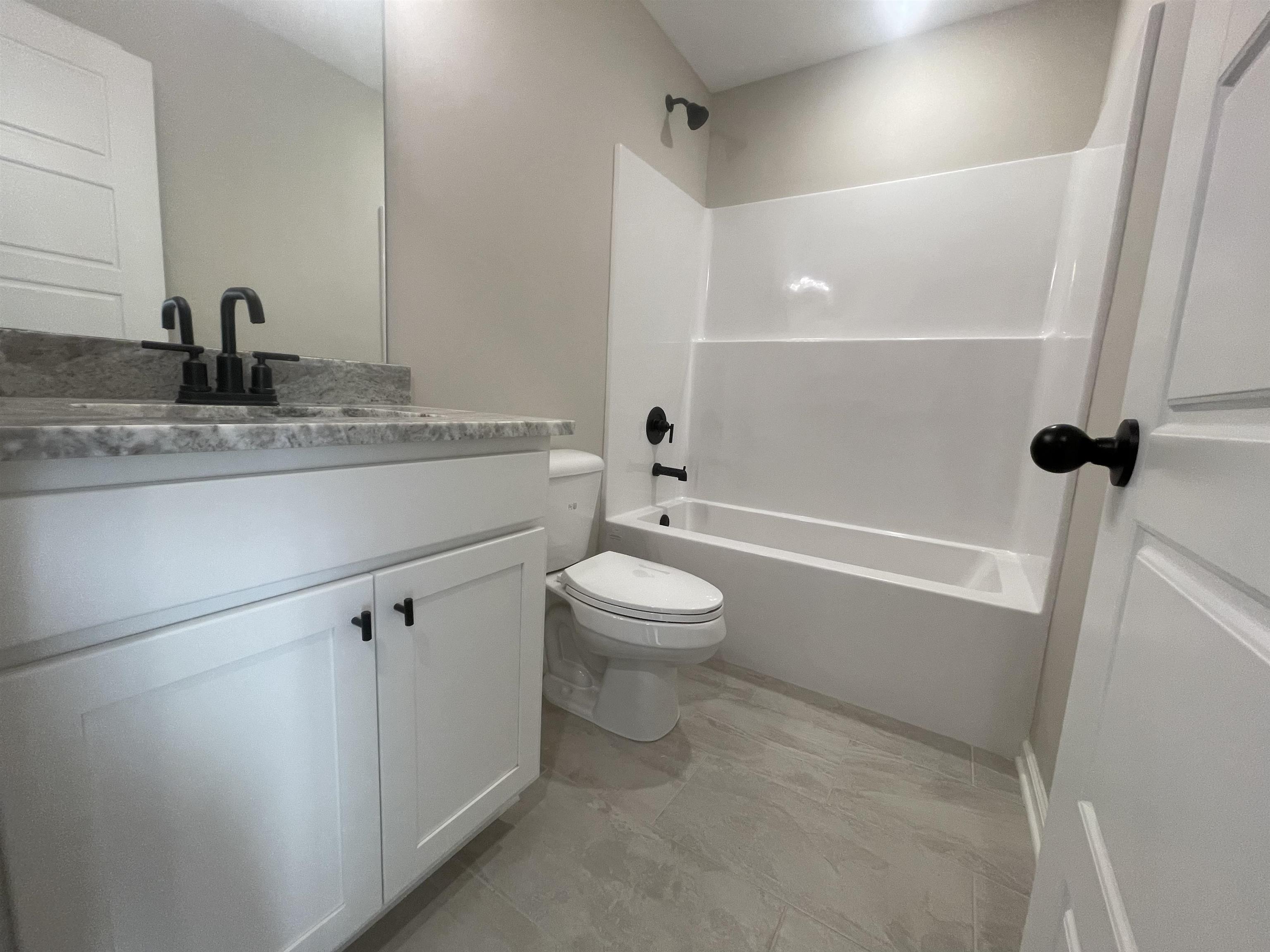 19 Columbia Way Atoka, TN 38004 - Photo 18 of 28 Bathroom featuring shower / washtub combination and vanity
